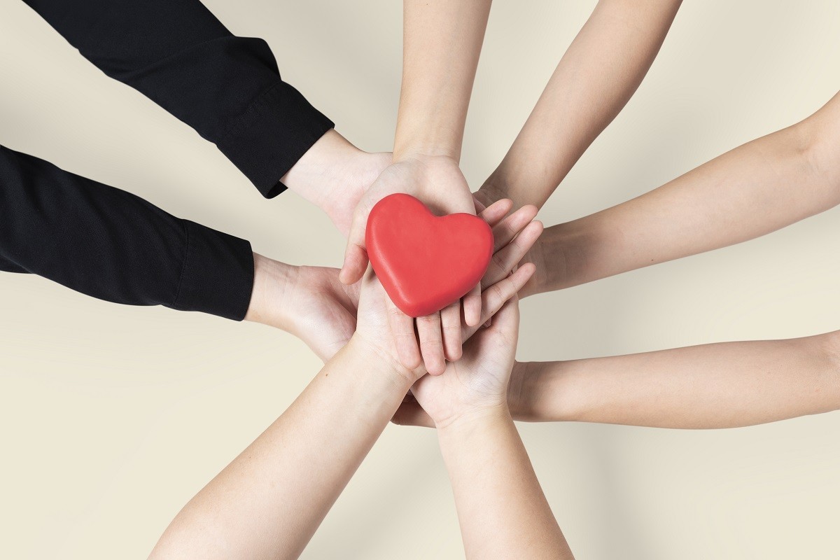 Hands united heart community of love