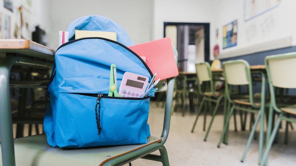 school backpack with supplies chair
