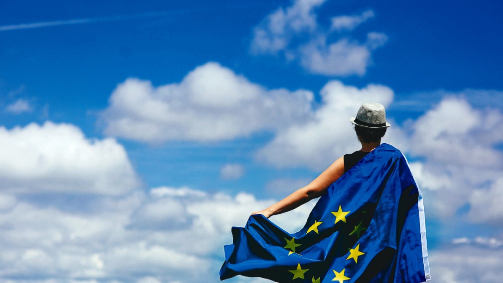 Young woman holding the European Union Flag. Voting concept.